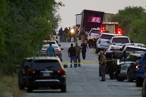 Police and other first responders work the scene where people have been found dead after a semitrailer containing suspected migrants was found. (Photo | AP)