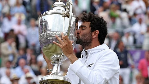 'Heartbroken': Matteo Berrettini kisses the trophy after winning the Queen's tournament. (File Photo | AFP)