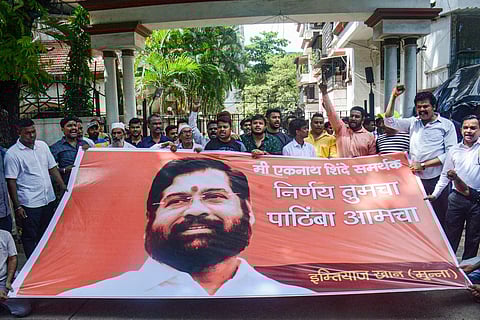 Supporters of rebel Shiv Sena leader Eknath Shinde shout slogans outside his residence in Thane, June 25, 2022. (Photo | PTI)