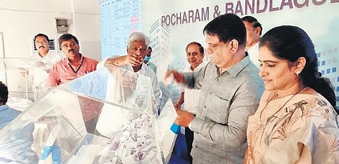MAUD Special Chief Secretary Arvind Kumar draws lots for the allocation of Pocharam Rajiv Swagruha flats in Hyderabad on Monday. (Photo | Express)