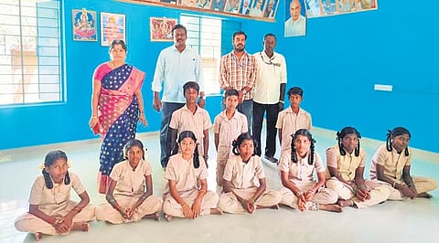 S Aruljothi with students and teachers at the renovated school building. (Photo | Express)