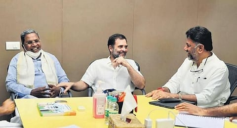 (From left) Opposition leader Siddaramaiah, Congress leader Rahul Gandhi, and KPCC president DK Shivakumar share a light moment during the meeting. (File Photo)