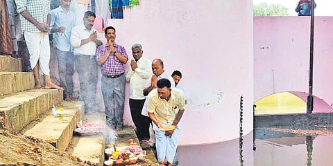 Farmers and officials offering prayers at the Melaiyur regulator in Mayiladuthurai district on Thursday, ahead of water release for irrigation. (Photo| EPS)