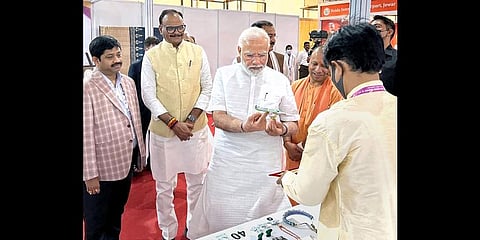 Modi with Yogi Adityanath visits stalls during the Ground Breaking Ceremony of the UP Investors Summit' at Indira Gandhi Pratishthan, in Lucknow, Friday, June 3, 2022. (Photo | PTI)