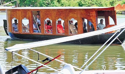 The shikara equipped with E-Marine technology cruising in the backwaters of Kochi  | T P Sooraj