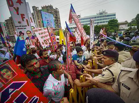 Police personnel stop student-activists during their Vidhan Sabha march in protest against the 'Agnipath' scheme, in Patna, Wednesday, June 29, 2022.  (Photo | PTI)