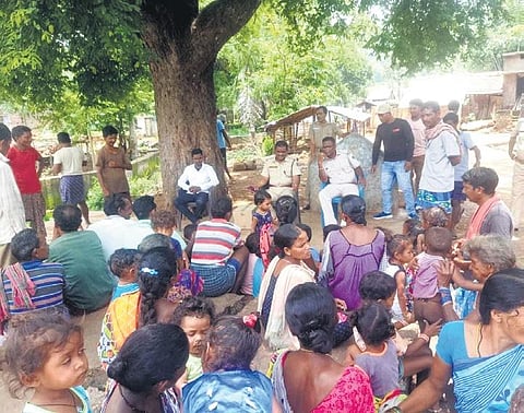A team of Koraput police interacting with locals at Naredivalasa village. (Photo | Express)