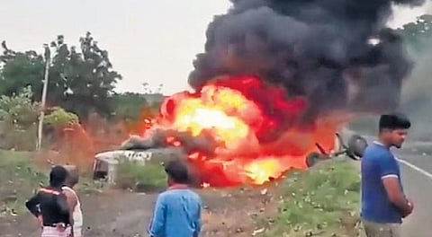 Flames engulf the ill-fated Orange Travels bus that caught fire after falling into a ditch near Kamalapur of Kalaburagi district in Karnataka early on Friday 