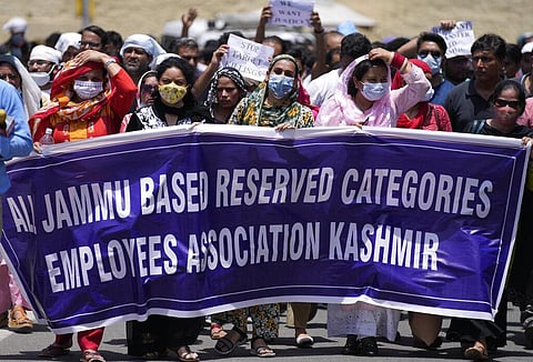 Employees of Jammu and Kashmir Teachers Association march in a protest against the killing of colleague Rajini Bala in Jammu. (Photo | AP)