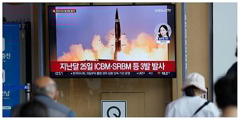 People watch a TV screen showing a news program reporting about North Korea's missile launch with file image, at a train station in Seoul on  Sunday, June 5, 2022 (Photo | AP)