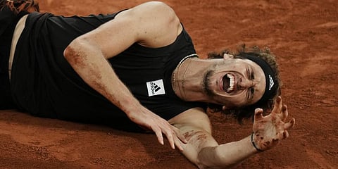 Germany's Alexander Zverev grimaces in pain after twisting his ankle during the semifinal match against Spain's Rafael Nadal at the French Open.(Photo | AP)