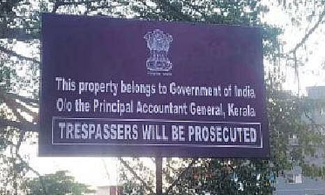 The new board in the 55-cent plot at Valiyasala, which has been handed over to Principal Accountant General, Kerala