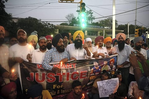 Members of Youth Congress take out a candlelight march in the memory of Punjabi singer and Congress leader Sidhu Moose Wala. (Photo | PTI)