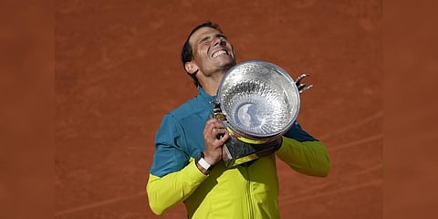 Spain's Rafael Nadal lifts the trophy after winning the final match against Norway's Casper Ruud at the French Open Sunday, June 5, 2022.(Photo | AP)