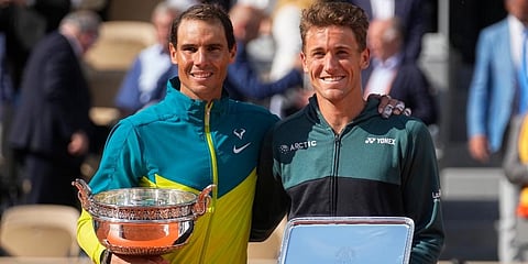 Rafael Nadal (L) holds the trophy after winning the final match against Casper Ruud in three sets, 6-3, 6-3, 6-0, at the French Open tennis tournament in Roland Garros Stadium in Paris. (Photo | AP)