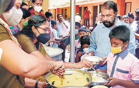 General Education Minister V Sivankutty joins students of Government UP School at Poojappura in Thiruvananthapuram to have a noon meal on Monday | B P Deepu