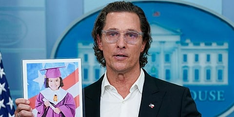 Actor Matthew McConaughey holds a picture of Alithia Ramirez, 10, who was killed in the Texas shooting, as he speaks during a press briefing at the White House on Tuesday, June 7. (Photo | AP)