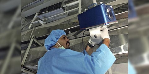An inspector of the International Atomic Energy Agency sets up surveillance equipment, at the Uranium Conversion Facility of Iran.(File Photo | AP)