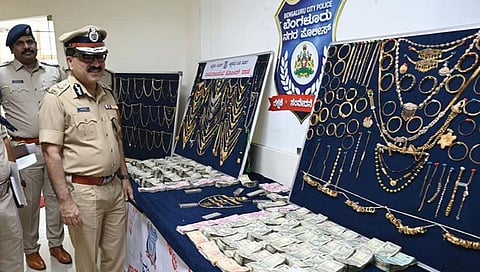 Bengaluru Police Commissioner Pratap Reddy inspects gold and cash seized by Chamarajpet police in Bengaluru on Tuesday | NAGARAJA GADEKAL