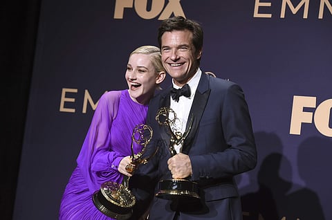 Julia Garner, winner of best outstanding supporting actress in a drama series for 'Ozark', poses with Jason Bateman. (File photo)