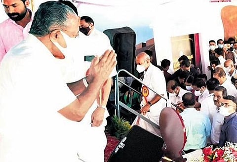Chief Minister Pinarayi Vijayan greets the audience after inaugurating the Special Sub Jail at Koothuparamba on Tuesday
