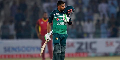 Pakistan's Babar Azam kisses his helmet after scoring century during the first one day international cricket match between Pakistan and West Indies at the Multan Cricket Stadium. (Photo | AP)