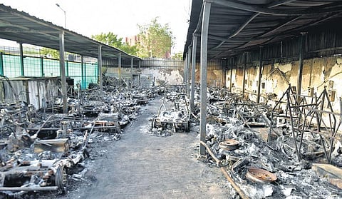 A massive blaze broke out at the electric motor parking in Jamia Nagar on Monday | Express