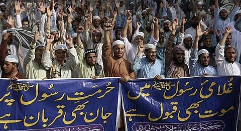 People chant anti-India slogans to condemn the derogatory references to Prophet Muhammad in Karachi, Pakistan, Monday.(Photo | AP)