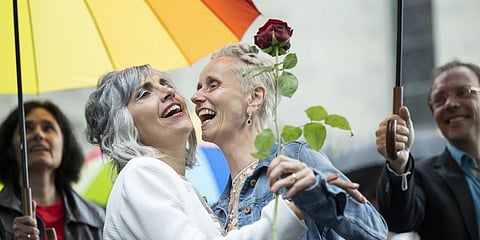 Annett Babinsky, right, and Laura Suarez celebrate their marriage at the registry office 'Amtshaus' in Zurich, Switzerland, Friday, July 1, 2022.
