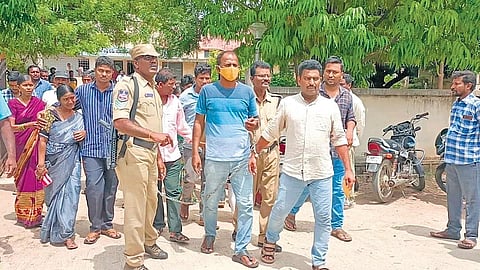 Police bring the oustees who were arrested from Gudatipally to a court in Husnabad of Siddipet district in handcuffs on Thursday. (Photo | Express)