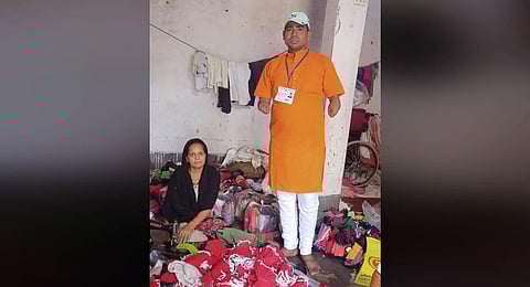 Naresh Kumar Patel with his wife Aarti at their cloth stitching training centre. (Photo | Express)