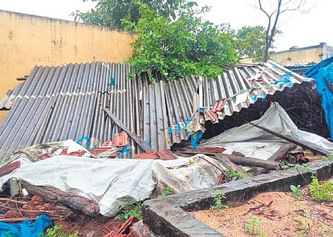 the remains of a damaged house in Indira Colony of Mangapet mandal on Sunday. (Photo | Express)