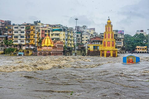 Temples submerged in floodwater after a rise in the water level of the Godavari river following the release of water from the Gangapur Dam and monsoon rains in Nashik. (Photo | PTI)