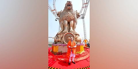 Modi unveiled the National Emblem cast on the roof of the New Parliament building. (Photo | Twitter, @Gupta_vijender)