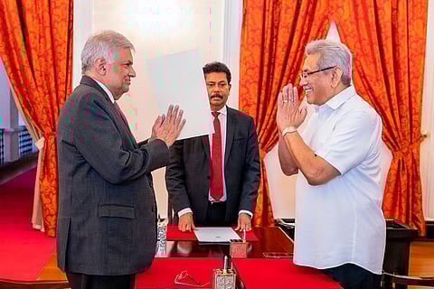 President Gotabaya Rajapaksa, right, greets prime minister Ranil Wickremesinghe during the latter's oath taking ceremony as the new finance minister in Colombo,  May 25, 2022. (File Photo | AP)