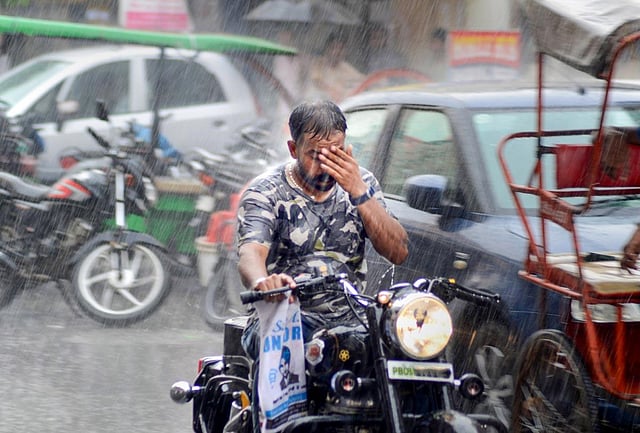 A man rides a motorcycle amid monsoon rain in Amritsar. The Chandigarh Indian Meteorological Department data shows that Punjab, Haryana and Chandigarh have received 33.8 mm and 42.8 mm and 181.1 mm rainfall respectively. (Photo | PTI)
