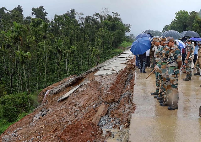 Due to continuous rains battering the coastal areas of North Karnataka, Chief Minister Basavaraj Bommai visited rain-hit areas in Kodagu and Dakshina Kannada districts.  Security personnel at the spot after a landslide due to heavy rainfall, in Dakshina Kannada district. (Photo | PTI)