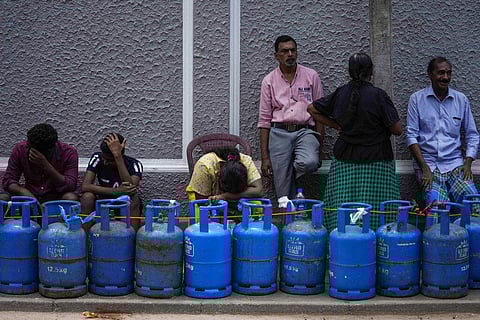 People wait in a queue expecting to buy cooking gas near a distribution center in Colombo, Sri Lanka, Tuesday, July 12, 2022. (Photo | AP)