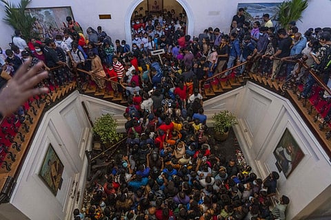 People throng President Gotabaya Rajapaksa’s official residence for the second day after it was stormed in Colombo, Sri Lanka. (Photo | AP)