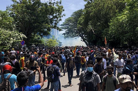 Demonstrators take part in an anti-government protest outside the office of Sri Lanka's prime minister in Colombo on July 13, 2022. (Photo | AFP)
