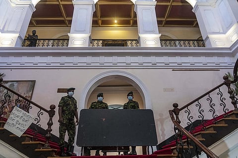 Sri Lankan army officers stand guard after protesters vacated the President Gotabaya Rajapaksa's official residence in Colombo, Sri Lanka, Thursday. (Photo | PTI)