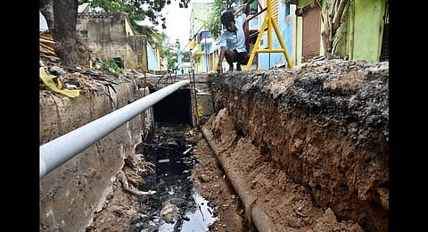 Metro Water pipeline stuck in the slab of stormwater drain at Ernavoor. (Photo | P Jawahar, EPS)