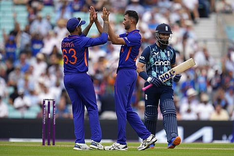 India's Prasidh Krishna, center, celebrates the dismissal of England's Moeen Ali, right, during the first one day international cricket match. (Photo | AP)