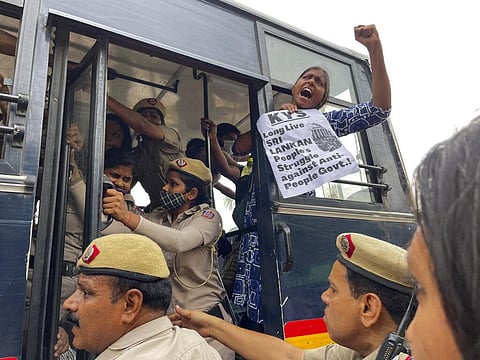 Delhi police detain Indian youth who were protesting expressing solidarity with Sri Lankan protestors outside Sri Lankan High Commission in New Delhi. (Photo | AP)