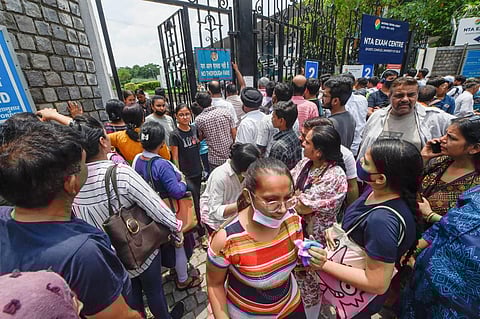 Students come out after appearing for the Common University Entrance Test-Undergraduate (CUET UG 2022), in the first slot, at North Campus in New Delhi. (Photo | PTI)