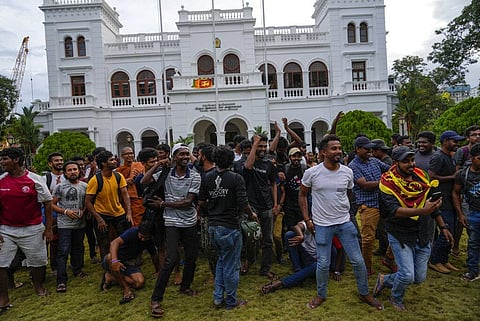 Protesters cheer as they leave prime minister Ranil Wickremesinghe's office building in Colombo, Sri Lanka, Thursday, July 14, 2022. (Photo | AP)