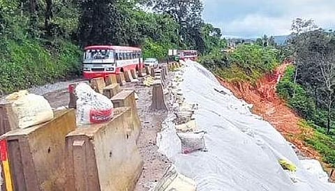 A bus crosses a landslide-hit road near Donigal on Mangaluru-Bengaluru NH 75 | Express