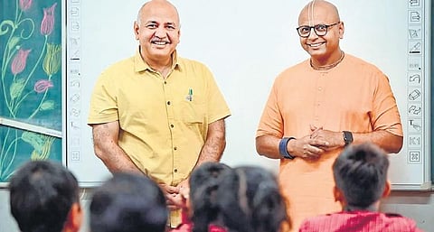 Deputy CM Manish Sisodia with lifestyle coach Gaur Gopal Das in a school | PTI