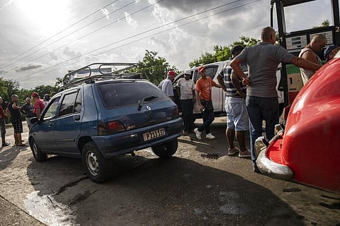 Drivers wait their turn to fuel their vehicles at a gas station in Havana, Cuba. (Photo | AP)