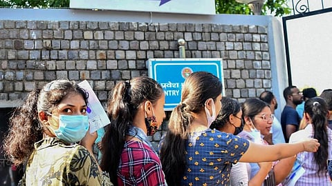 Students arrive to appear for the Common University Entrance Test-Undergraduate (CUET UG 2022), in New Delhi.